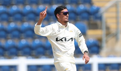 220626 - Glamorgan v Surrey, Rothesay County Championship Division 1- Rahul Chahar of Surrey celebrates taking the wicket of Asa Tribe of Glamorgan