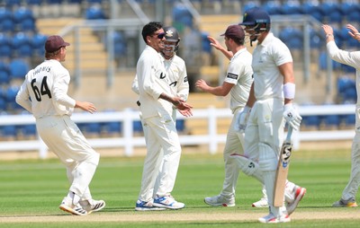 220626 - Glamorgan v Surrey, Rothesay County Championship Division 1- Rahul Chahar of Surrey celebrates taking the wicket of Asa Tribe of Glamorgan