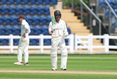 220626 - Glamorgan v Surrey, Rothesay County Championship Division 1- Kiran Carlson of Glamorgan celebrates his 50