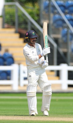 220626 - Glamorgan v Surrey, Rothesay County Championship Division 1- Kiran Carlson of Glamorgan celebrates his 50