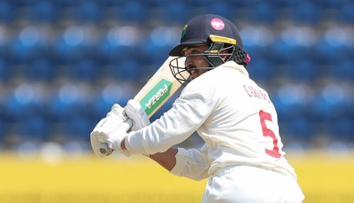 220626 - Glamorgan v Surrey, Rothesay County Championship Division 1- Kiran Carlson of Glamorgan plays a shot