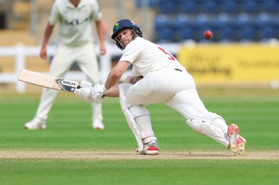 220626 - Glamorgan v Surrey, Rothesay County Championship Division 1- Sean Dickson of Glamorgan plays a shot