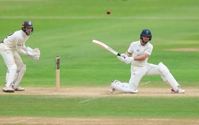 220626 - Glamorgan v Surrey, Rothesay County Championship Division 1- Sean Dickson of Glamorgan hits a four