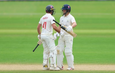 220626 - Glamorgan v Surrey, Rothesay County Championship Division 1- Sean Dickson of Glamorgan and Colin Ingram of Glamorgan celebrate the win over Surrey