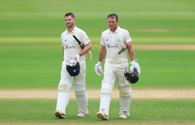 220626 - Glamorgan v Surrey, Rothesay County Championship Division 1- Sean Dickson of Glamorgan and Colin Ingram of Glamorgan celebrate the win over Surrey