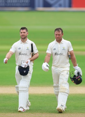 220626 - Glamorgan v Surrey, Rothesay County Championship Division 1- Sean Dickson of Glamorgan and Colin Ingram of Glamorgan celebrate the win over Surrey