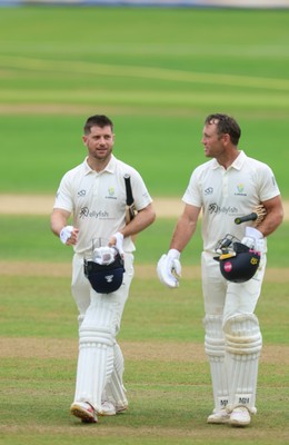 220626 - Glamorgan v Surrey, Rothesay County Championship Division 1- Sean Dickson of Glamorgan and Colin Ingram of Glamorgan celebrate the win over Surrey