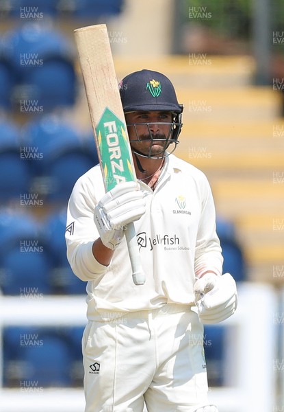 220626 - Glamorgan v Surrey, Rothesay County Championship Division 1- Kiran Carlson of Glamorgan celebrates his 50