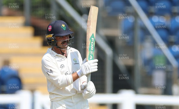 220626 - Glamorgan v Surrey, Rothesay County Championship Division 1- Kiran Carlson of Glamorgan celebrates his 50
