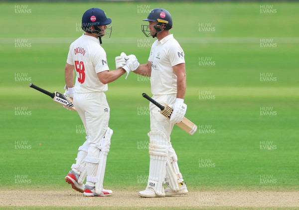 220626 - Glamorgan v Surrey, Rothesay County Championship Division 1- Colin Ingram of Glamorgan is congratulated win his 50 by Sean Dickson of Glamorgan