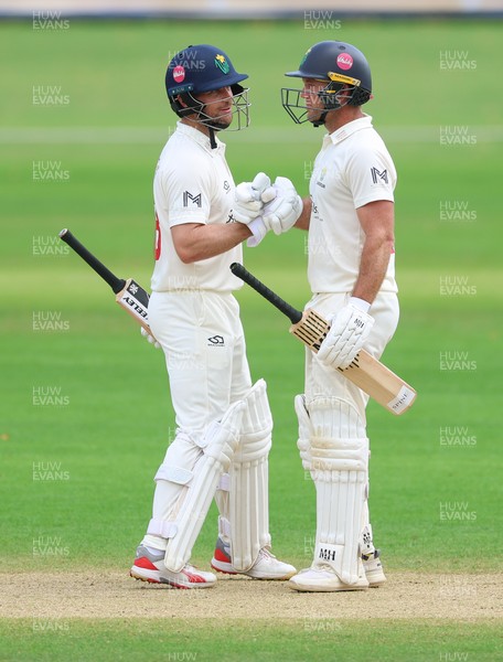 220626 - Glamorgan v Surrey, Rothesay County Championship Division 1- Colin Ingram of Glamorgan is congratulated win his 50 by Sean Dickson of Glamorgan