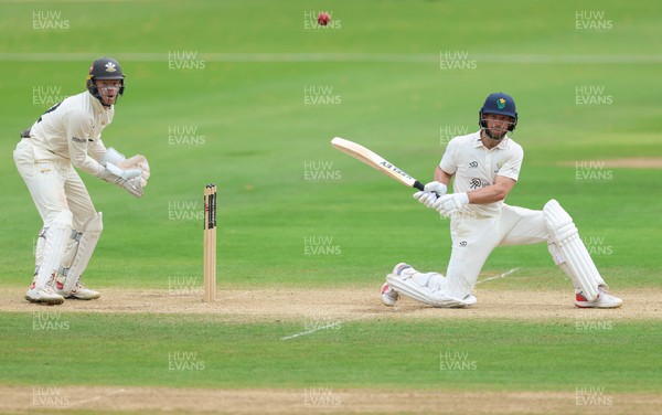 220626 - Glamorgan v Surrey, Rothesay County Championship Division 1- Sean Dickson of Glamorgan hits a four
