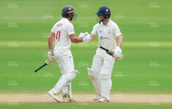 220626 - Glamorgan v Surrey, Rothesay County Championship Division 1- Sean Dickson of Glamorgan and Colin Ingram of Glamorgan celebrate the win over Surrey