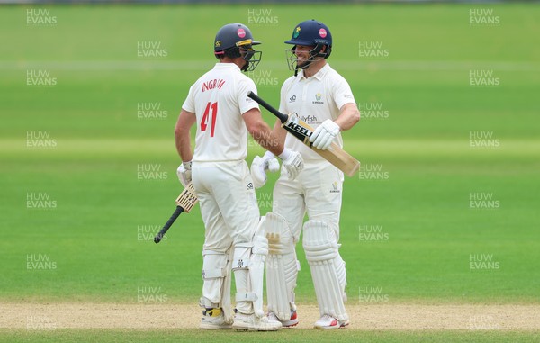 220626 - Glamorgan v Surrey, Rothesay County Championship Division 1- Sean Dickson of Glamorgan and Colin Ingram of Glamorgan celebrate the win over Surrey
