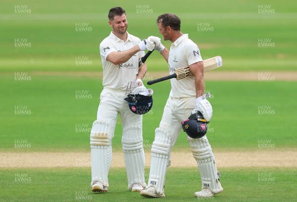 220626 - Glamorgan v Surrey, Rothesay County Championship Division 1- Sean Dickson of Glamorgan and Colin Ingram of Glamorgan celebrate the win over Surrey