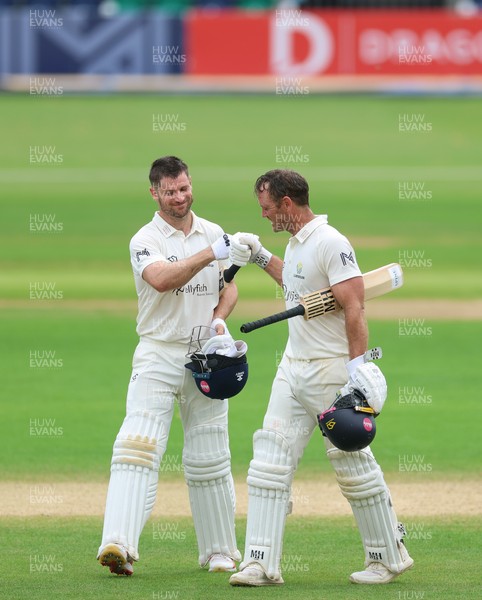 220626 - Glamorgan v Surrey, Rothesay County Championship Division 1- Sean Dickson of Glamorgan and Colin Ingram of Glamorgan celebrate the win over Surrey