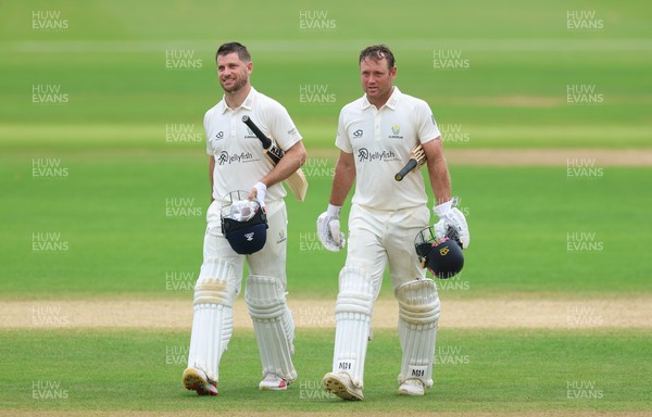 220626 - Glamorgan v Surrey, Rothesay County Championship Division 1- Sean Dickson of Glamorgan and Colin Ingram of Glamorgan celebrate the win over Surrey