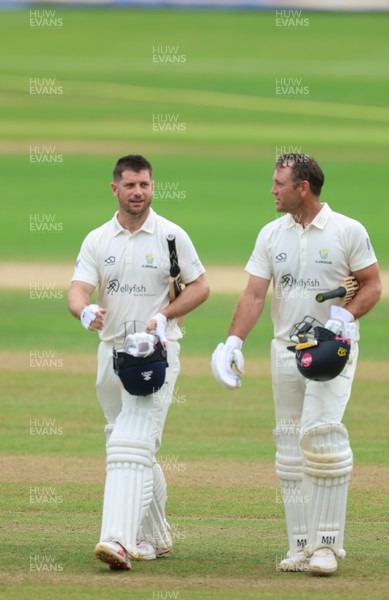 220626 - Glamorgan v Surrey, Rothesay County Championship Division 1- Sean Dickson of Glamorgan and Colin Ingram of Glamorgan celebrate the win over Surrey