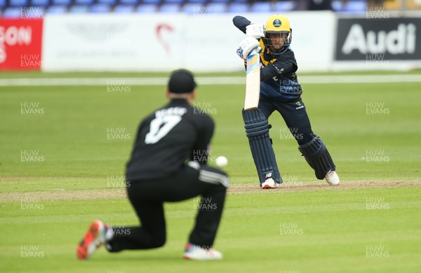 280419 - Glamorgan v Surrey, Royal London One Day Cup - Billy Root of Glamorgan sees his shot fielded by Rory Burns of Surrey
