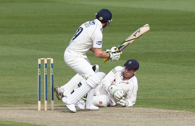 09.04.10 ... Glamorgan v Sussex, LV County Championship, SWALEC Stadium, Cardiff -  Glamorgans wicket-keeper Mark Wallace collects the ball as Sussex' s Andrew Hodd looks on 