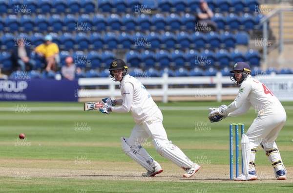 120622 - Glamorgan v Sussex, LV= County Championship, Division 2 - Tom Clark of Sussex plays a shot as Chris Cooke of Glamorgan  looks on