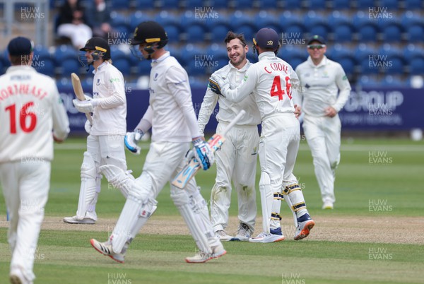 120622 - Glamorgan v Sussex, LV= County Championship, Division 2 - Andrew Salter of Glamorgan celebrates with team mates after Tom Clark of Sussex is caught by Colin Ingram of Glamorgan of his bowling