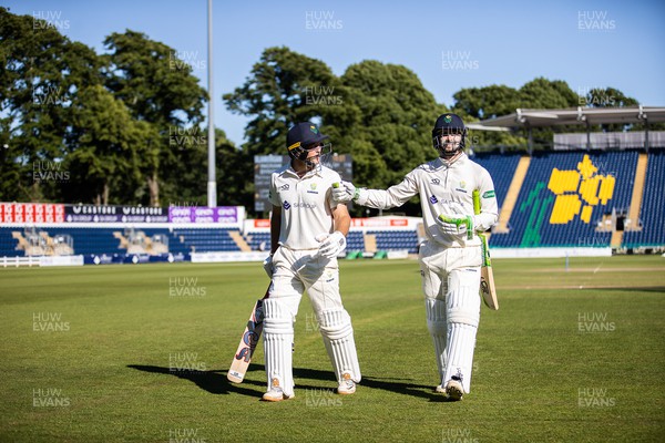 130622 - Glamorgan v Sussex - LV= County Championship - Division Two - Colin Ingram and Edward Byrom of Glamorgan leave the field at the end of the day