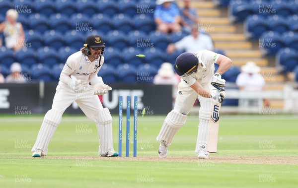 250623 - Glamorgan v Sussex, LV= Insurance County Championship, Div 2 - Chris Cooke of Glamorgan is bowled by Jack Carson of Sussex