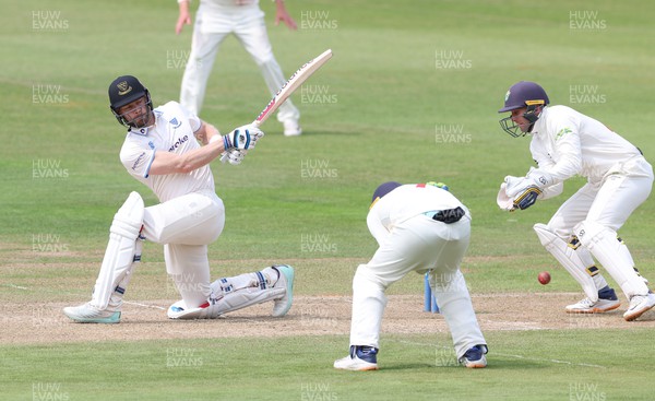 250623 - Glamorgan v Sussex, LV= Insurance County Championship, Div 2 - Nathan McAndrew of Sussex plays a shot past Billy Root of Glamorgan
