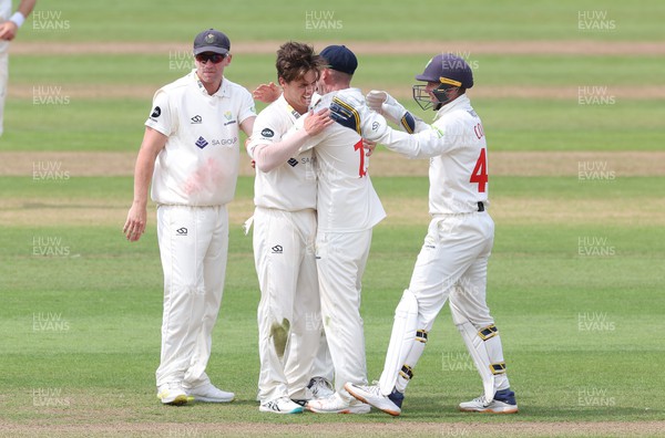 250623 - Glamorgan v Sussex, LV= Insurance County Championship, Div 2 - Mitchell Swepson of Glamorgan is congratulated after he takes the wicket of Nathan McAndrew of Sussex