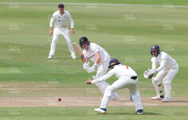 250623 - Glamorgan v Sussex, LV= Insurance County Championship, Div 2 - Jack Carson of Sussex plays a shot past Billy Root of Glamorgan