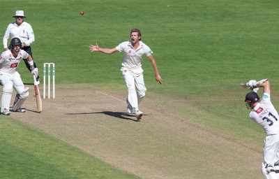 260816 - Glamorgan v Sussex, Specsavers County Championship, Division 2 - Michael Hogan of Glamorgan watches as the ball passes out of his reach off the bat of Luke Wells of Sussex