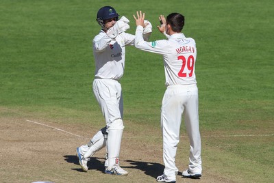 260816 - Glamorgan v Sussex, Specsavers County Championship, Division 2 - Owen Morgan of Glamorgan celebrates with Mark Wallace of Glamorgan and Graham Wagg of Glamorgan after taking the wicket of Luke Wells of Sussex