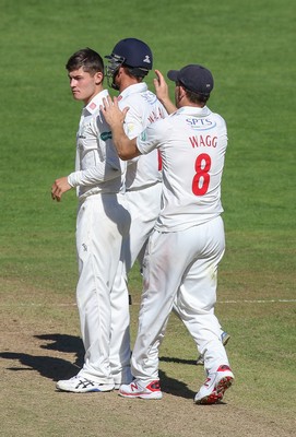 260816 - Glamorgan v Sussex, Specsavers County Championship, Division 2 - Owen Morgan of Glamorgan celebrates with Mark Wallace of Glamorgan and Graham Wagg of Glamorgan after taking the wicket of Luke Wells of Sussex