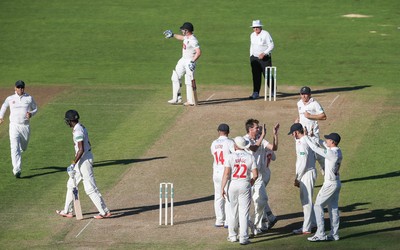 260816 - Glamorgan v Sussex, Specsavers County Championship, Division 2 - Michael Hogan of Glamorgan celebrates after Jofra Archer of Sussex is caught by Mark Wallace of Glamorgan