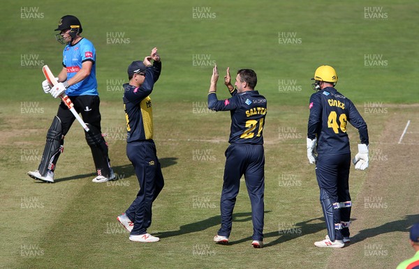 260819 - Glamorgan v Sussex Sharks - Vitality T20 Blast - Andrew Salter of Glamorgan celebrates with team mates  after Phil Salt of Sussex is bowled out
