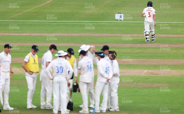 270623 - Glamorgan v Sussex, LV= Insurance County Championship, Div 2 - Kiran Carlson of Glamorgan makes his way back to the pavilion after being given out lbw off Tom Haines of Sussex
