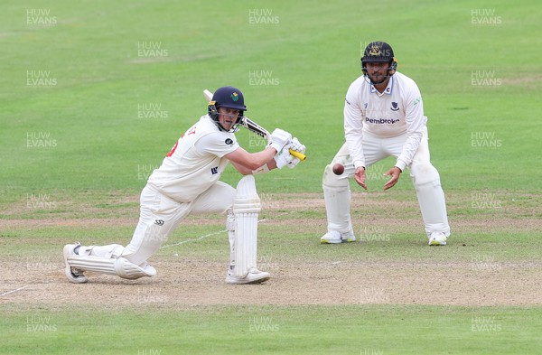 270623 - Glamorgan v Sussex, LV= Insurance County Championship, Div 2 - Sam Northeast of Glamorgan plays a shot as Danial Ibrahim of Sussex looks on