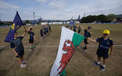 220726 - Glamorgan v Sussex Sharks, Metro Bank One Day Cup - The guard of honour waits to welcome the players