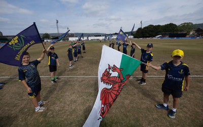220726 - Glamorgan v Sussex Sharks, Metro Bank One Day Cup - The guard of honour waits to welcome the players