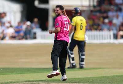 220726 - Glamorgan v Sussex Sharks, Metro Bank One Day Cup - Fynn Hudson-Prentice of Sussex celebrates as he dismisses Will Smale of Glamorgan