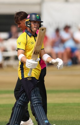 220726 - Glamorgan v Sussex Sharks, Metro Bank One Day Cup - Alex Horton of Glamorgan  raises his bat as he reaches his 50 runs
