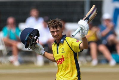 220726 - Glamorgan v Sussex Sharks, Metro Bank One Day Cup - Jack Hope-Bell of Glamorgan celebrates as he reaches his maiden 100 runs