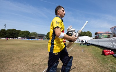 220726 - Glamorgan v Sussex Sharks, Metro Bank One Day Cup - Alex Horton of Glamorgan leaves the pitch after being dismissed on 122