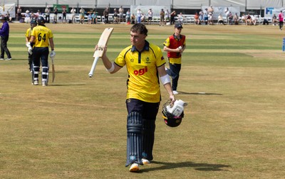 220726 - Glamorgan v Sussex Sharks, Metro Bank One Day Cup - Alex Horton of Glamorgan leaves the pitch after being dismissed on 122