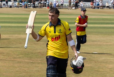 220726 - Glamorgan v Sussex Sharks, Metro Bank One Day Cup - Alex Horton of Glamorgan leaves the pitch after being dismissed on 122
