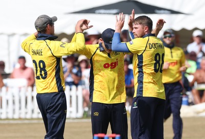 220726 - Glamorgan v Sussex Sharks, Metro Bank One Day Cup - Dan Douthwaite of Glamorgan celebrates after taking the wicket of Dan Ibrahim of Sussex