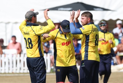 220726 - Glamorgan v Sussex Sharks, Metro Bank One Day Cup - Dan Douthwaite of Glamorgan celebrates after taking the wicket of Dan Ibrahim of Sussex