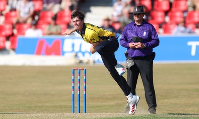 220726 - Glamorgan v Sussex Sharks, Metro Bank One Day Cup - Romano Franco of Glamorgan bowls