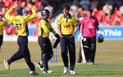 220726 - Glamorgan v Sussex Sharks, Metro Bank One Day Cup - Romano Franco of Glamorgan celebrates after taking the wicket of  Fynn Hudson-Prentice of Sussex